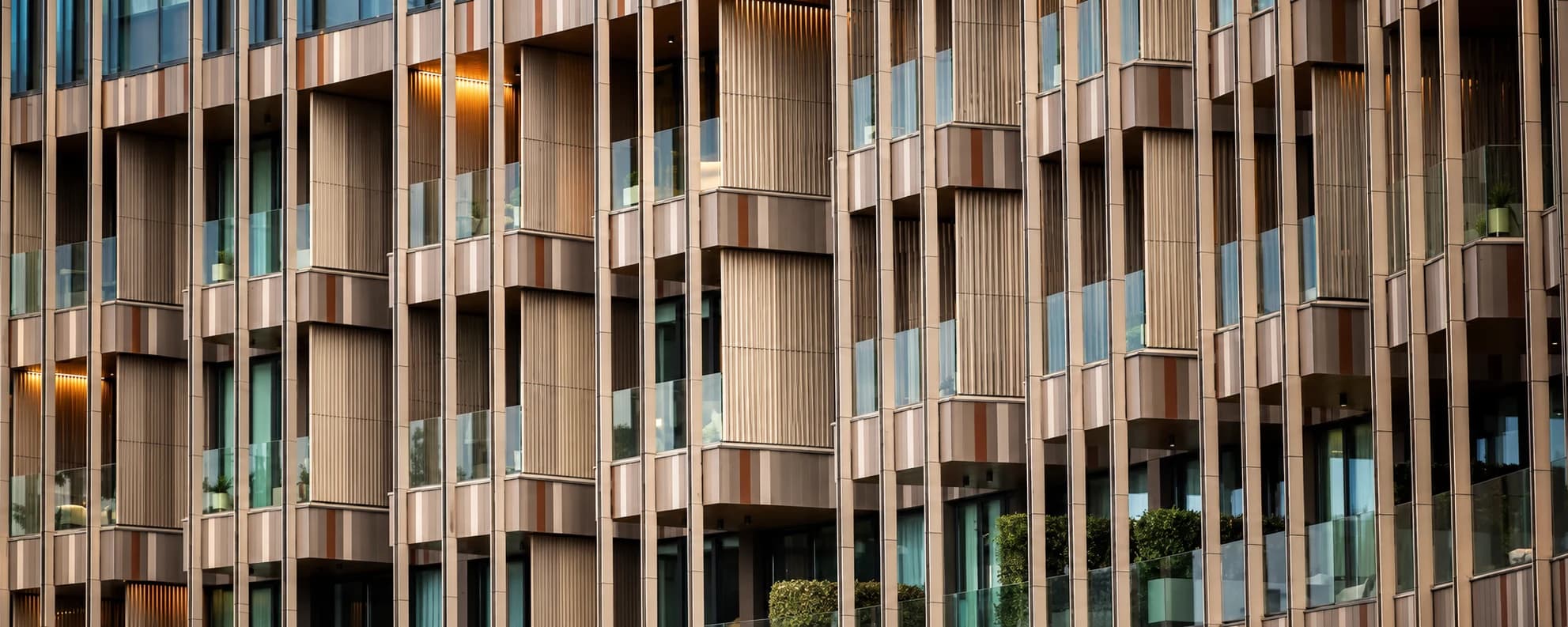 Advanta Consulting — bronze-toned ventilated facade with vertical fins